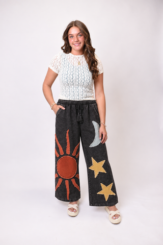 Model photo with black celestial pants